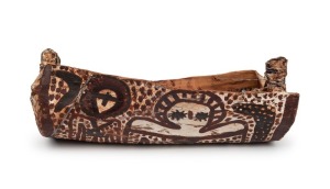 LILY KARADADA, Wandjina (Rain Spirit), coolamon (eucalyptus bark, ochre, clay and acrylic), with COA and photographs supplied 15cm high, 50cm wide, 23cm deep