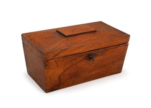 An early Colonial Australian cedar tea caddy of sarcophagus form enclosing two lidded compartments with reeded&nbsp;ebony knobs. Cedar veneer on cedar substrate, original lock and key, circa 1830. 11cm high, 21cm wide, 11.5cm deep. ​​​​​​​PROVENANCE: Ancanthe 