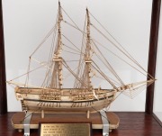A fine quality antique Napoleonic prisoner of war whalebone model ship, 18th/19th century, housed in a later timber and glass display cabinet from the late 20th century. Accompanied by a 1990 purchase receipt from&nbsp;Trevor Philip & Sons of London, dated 199 - 2
