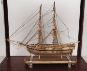 A fine quality antique Napoleonic prisoner of war whalebone model ship, 18th/19th century, housed in a later timber and glass display cabinet from the late 20th century. Accompanied by a 1990 purchase receipt from&nbsp;Trevor Philip & Sons of London, dated 199 - 3