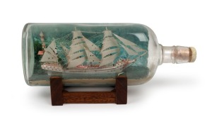 Ship in a bottle, vintage display on stand, 20th century, 30cm wide