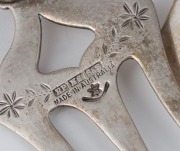 Four Australiana silver plated bread forks with emus, kangaroo, boomerang and Australian map, two with fiddleback blackwood handles, by Stoke & Sons and Stewart Dawson, 19th/20th century, ​​​​​​​the largest 26cm long - 5