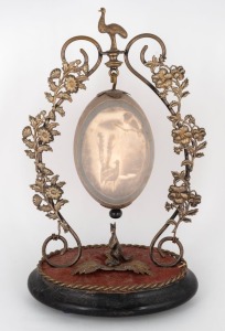 An antique Australian silver plated emu egg ornament carved with lyrebird in bush landscape, adorned with kangaroo and emu finial, late 19th century, 30.5cm high