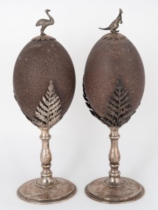 A pair of antique Australian silver plated emu egg ornaments, adorned with ferns, kangaroo and emu, circa 1900, 27cm high