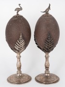 A pair of antique Australian silver plated emu egg ornaments, adorned with ferns, kangaroo and emu, circa 1900, ​​​​​​​27cm high