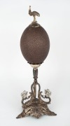 An antique emu egg ornament with silver plated mounts adorned with emu finial and later applied koalas, circa 1900, ​​​​​​​34cm high