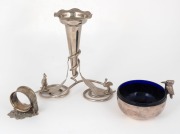 An Australian silver plated single trumpet epergne decorated with gum leaves, kangaroo and emu; together with a silver plated kookaburra bowl with blue glass liner, and a silver plated napkin ring with kangaroo decoration, 19th/20th century, (3 items), th