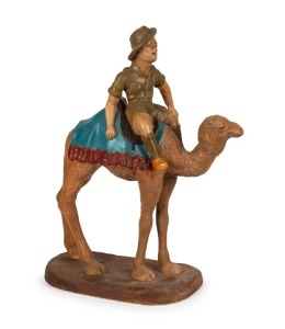 A hand-painted chalk ware sculpture depicting&nbsp;a digger riding a camel, inspired by the Imperial Camel Corps in Egypt, 20th century, Note:&nbsp;An example is held in the Australian War Museum, Canberra.&nbsp; 64cm high.