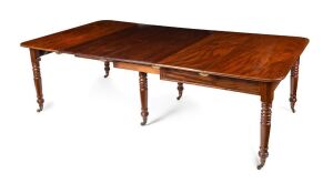 An antique English mahogany six leg draw leaf extension dining table with triple ring turning, original brass castors and fine tablet decorated frieze, circa 1840, two leaves replaced, one original, 75cm high, 108cm wide (248cm extended), 133cm deep.