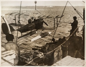 THE B.A.N.Z. ANTARCTIC EXPEDITION: Official original photograph by Captain Frank Hurley: Image A51 - Title: Off on a Flight of Exploration, with official "MAWSON ANTARCTIC EXPEDITION" handstamp&nbsp;and release date "TUESDAY MAY 6, 1930" verso, together with o