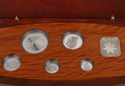 Five-piece platinum Koala proof Set for 2004,&nbsp;Australian Stories - Sports commemorative issue, $5, $15, $25, $50, and $100 Dollars, all Gem Proofs in the original wooden case; numbered 065 of 200. - 2