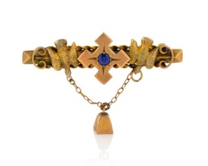 ALFRED JACKSON, of Fremantle, Western Australia, 9ct yellow gold and blue sapphire bar brooch decorated with flying doves and suspended bell, 19th century. Jackson arrived in the Colonies as a convict in 1866. This brooch is featured in the reference book