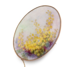 JOSEPH LAWRENCE of Melbourne hand-painted porcelain brooch with wattle blossom decoration, mounted in 9ct rose gold, early 20th century, stamped "9" flanked by pictorial marks, ​​​​​​​6.5cm high
