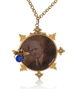 BENJAMIN & SONS of Melbourne fine quality antique 9ct gold double sided photo pendant adorned with insect decoration set with blue stones and seed pearls, suspended on 9ct gold chain, stamped "9" flanked by pictorial marks, the pendant 4.5cm high, the cha