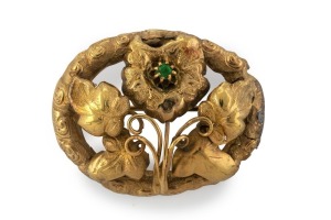 A Colonial Australian 9ct gold oval brooch with floral motif, set with a green stone, circa 1860s, 4cm wide, 7.6 grams.