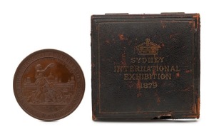 SYDNEY INTERNATIONAL EXHIBITION 1879: Large bronze medal by Wyon&nbsp;(76mm) awarded to A.H. GASPARINI&nbsp;FOR SERVICE and housed in the original Wyon presentation box (a little dilapidated) with gilt "SYDNEY INTERNATIONAL EXHIBITION 1879" to top of lid.