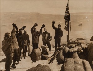 THE B.A.N.Z. ANTARCTIC EXPEDITION: Official original photograph by Captain Frank Hurley: Image A42 - Title: Cheering the Flag, with official "MAWSON ANTARCTIC EXPEDITION" handstamp&nbsp;and release date "MONDAY APR. 28,&nbsp;1930" verso, together with part of the o