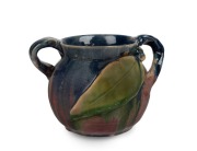 PAMELA unusual two handled pottery vase with applied gumnut and leaf glazed in pink, blue and green, incised "Pamela", 11.5cm high, 16.5cm wide