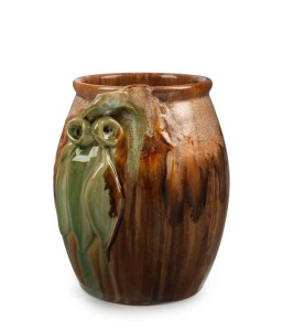 REMUED barrel shaped pottery vase with applied gumnuts and leaves, glazed in green and brown, incised "Remued", 16cm high