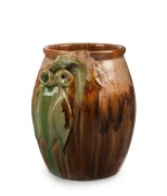 REMUED barrel shaped pottery vase with applied gumnuts and leaves, glazed in green and brown, incised "Remued", 16cm high