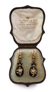 A stunning pair of Australian Colonial antique gold and black enamel earrings adorned with seed pearls in floral motif, housed in a plush fitted leather box with retailer's branding "KILPATRICK & CO. GOLDSMITHS & JEWELLERS TO HIS EXCELLENCY. 39 Collins St