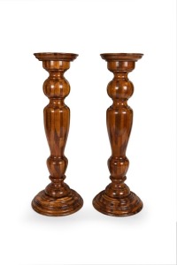 A fine pair of antique Australian block parquetry pedestals constructed from selected Australian native timbers with turned baluster columns, circa 1890, 117cm high, the tops 32cm diameter