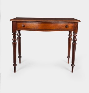 An antique Australian cedar one drawer hall table with serpentine front, 19th century, ​​​​​​​74cm high. 90cm wide, 50cm deep