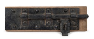Gaol door antique iron lock, mounted on timber, 19th century, 55cm wide