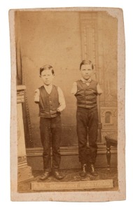 circa 1875 carte-de-visite&nbsp;with albumen paper print of "The Burns Boys", with printed details verso, "Photographs of The Burns Boys, and The Bark Mill Machinery by which they lost their arms, at Portland. Evening News office, Sandhurst".&nbsp;