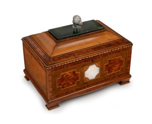 A fine quality antique New&nbsp;Zealand specimen wood box, inlaid with silver name plaque, greenstone top and silver kiwi bird finial, early 20th century, bearing maker's plaque to the underside "MARTIN WELLINGTON NEW ZEALAND", 22cm high, 29cm wide, 20cm deep.