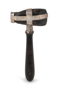 [THE WAR IN ZEALAND]. Maori stone axe head, mounted in silver with turned timber handle, engraved "FOUND NEAR THE SCENE OF THE MURDER OF 2 OFFICERS AND 6 OR's '57' REG.t, NEW ZEALAND 1863", 17cm high.