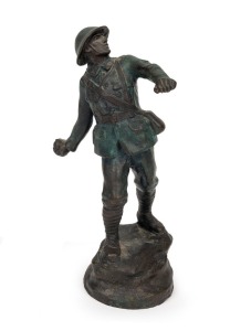 A BRONZE STATUETTE depicting a World War One soldier throwing a hand grenade, titled "The Bomb Thrower", overall 24cm high.