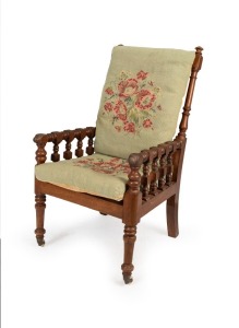 An antique Australian turned blackwood armchair with sage green floral tapestry cushions, circa 1870, 59cm across the arms