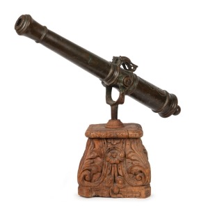 An antique Spanish bronze three quarter deck cannon, mid 18th century, with later timber mount, 81cmm long