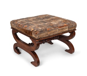 An antique Australian kauri pine and cedar cross framed stool with sleigh feet and turned stretcher, handsomely upholstered in platypus furs, circa 1850, ​​​​​​​40cm high, 57cm wide, 55cm deep.