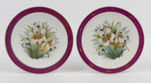 23 · A pair of antique English cabinet plates with hand-painted floral scenes, mid 19th century, 23cm diameter
