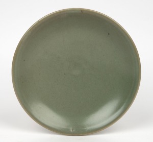 HAROLD HUGHAN celadon pottery plate, signed "Hughan", 20.5cm diameter