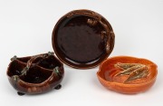 HARVEY SCHOOL brown glazed segmented pottery dish with applied gumnuts; together with a brown glazed pottery bowl with applied lizarrd decoration, signed "K. Dallas, R. G. H., '67" and a brown glazed pottery bowl with applied gum leaf decoration, (3 items