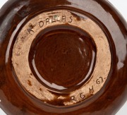 HARVEY SCHOOL brown glazed segmented pottery dish with applied gumnuts; together with a brown glazed pottery bowl with applied lizarrd decoration, signed "K. Dallas, R. G. H., '67" and a brown glazed pottery bowl with applied gum leaf decoration, (3 items - 2