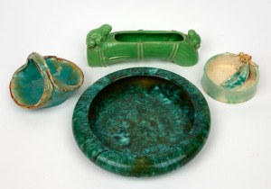 Green glazed pottery flower trough with frog decoration; together with two green glazed bowls with applied gum leaf decoration (one example with gumnuts) and a mottled green glazed pottery bowl, (4 items), the trough 23cm wide