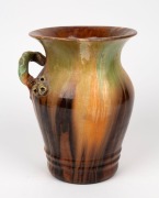 REMUED&nbsp;brown and green glazed pottery vase with applied gumnuts,&nbsp;leaf and branch handle, incised "Remued,&nbsp;Hand Made, 196/9M", 23.5cm high,&nbsp; - 2
