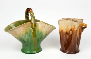 REMUED unusual shaped brown glazed pottery vase with applied branch handle; together with a green glazed basket vase, (2 items), both incised "Remued", 20.5cm and 27cm high,