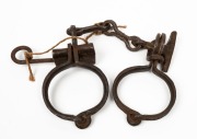CONVICT LEG IRONS, 19th century, ​​​​​​​37cm wide.