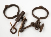 CONVICT LEG IRONS, 19th century, ​​​​​​​37cm wide. - 2