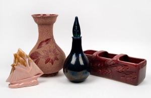 361 · M.C.P. burgundy glazed pottery flower trough; together with an unusual maroon glazed floral vase, a pink glazed pottery yacht ornament and a blue glazed pottery decanter signed "E. Searle, '67", (4 items), the largest 31cm high