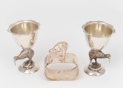 A pair of antique silver plated New Zealand kiwi bird eggcups, together with a silver plated kiwi bird napkin ring, 19th/20th century, (3 items) the eggcups 7.5cm high.
