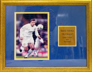 MARK VIDUKA, signed action photograph, window mounted, framed & glazed, overall 58x48cm.