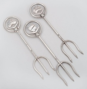 81 · STOKES & SONS of Melbourne group of three antique silver plated bread forks with Australian and Tasmanian map finials, 19th/20th century, ​​​​​​​20cm high.