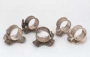 A set of five antique Australian silver plated napkin rings with Australian map bases, three with kangaroo decoration, the other two with emus, by STOKES & SONS of Melbourne, 19th/20th century, ​​​​​​​5.5cm high
