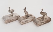 Three assorted antique Australian silver plated napkin rings with kangaroo and emu&nbsp;finial, by STOKES & SONS and STEWART DAWSON & Co., 19th/20th century, the largest 7cm high.
